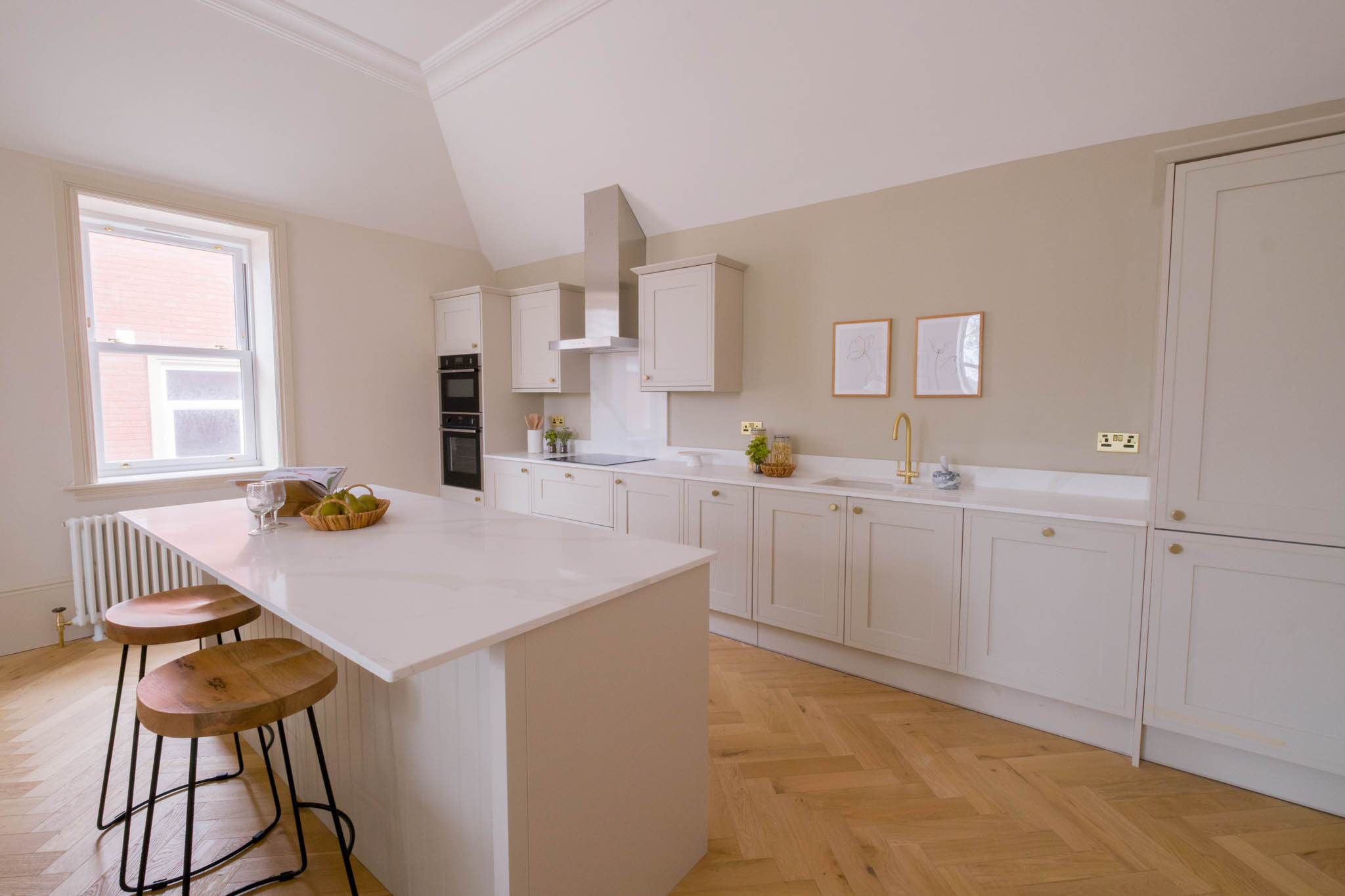 A spacious modern kitchen and food preparation area inside of a Gloucestershire residential property.