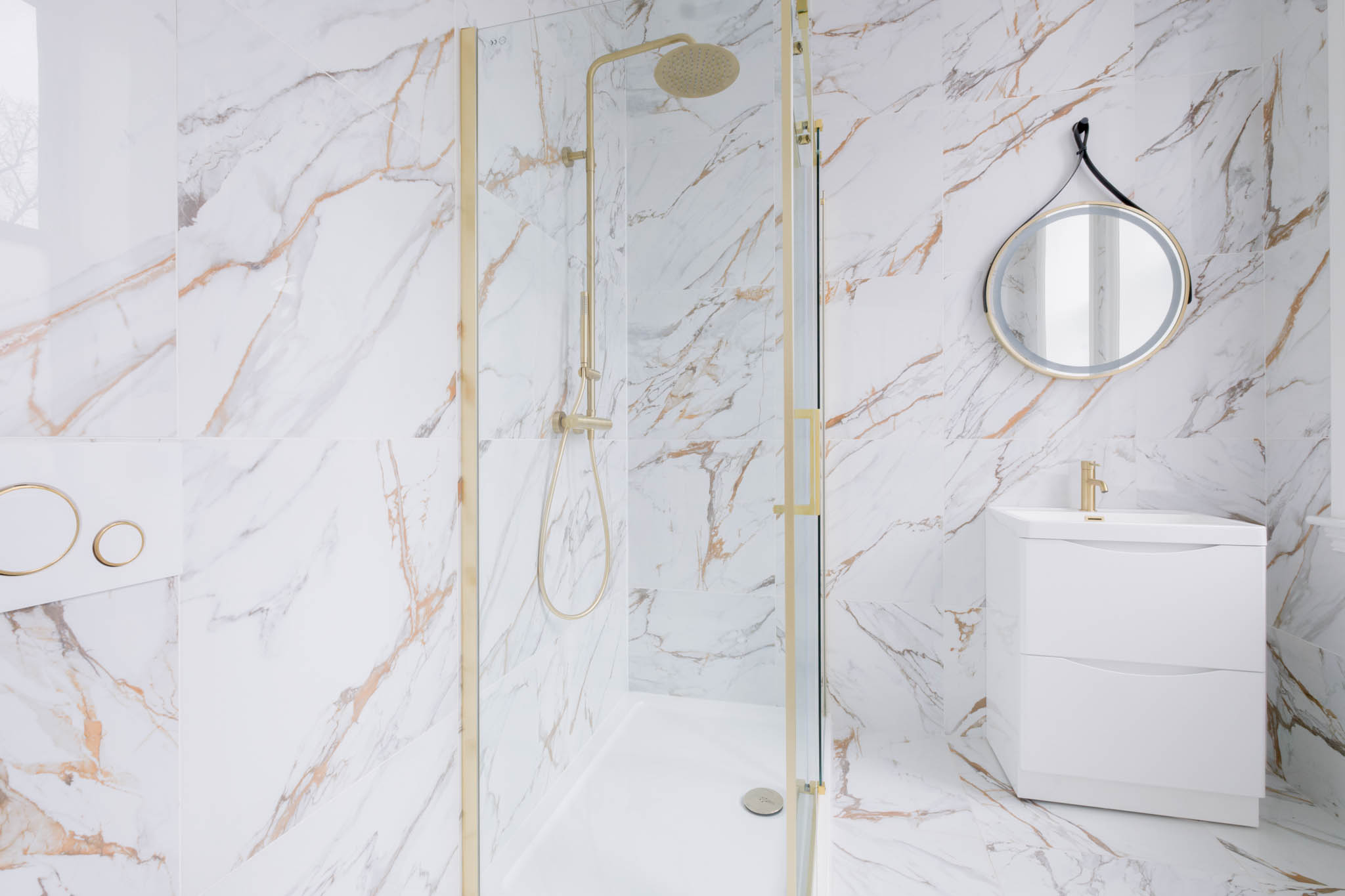A luxury tiled bathroom inside of a Gloucestershire residential property.