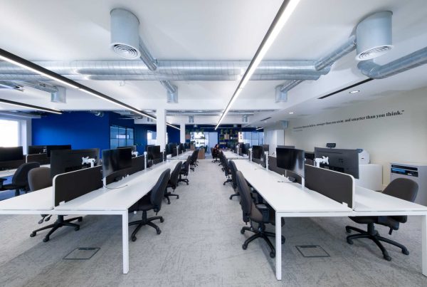 An open plan well-lit modern office space. The photography highlights the corporations branding elements. Property photography Gloucestershire.
