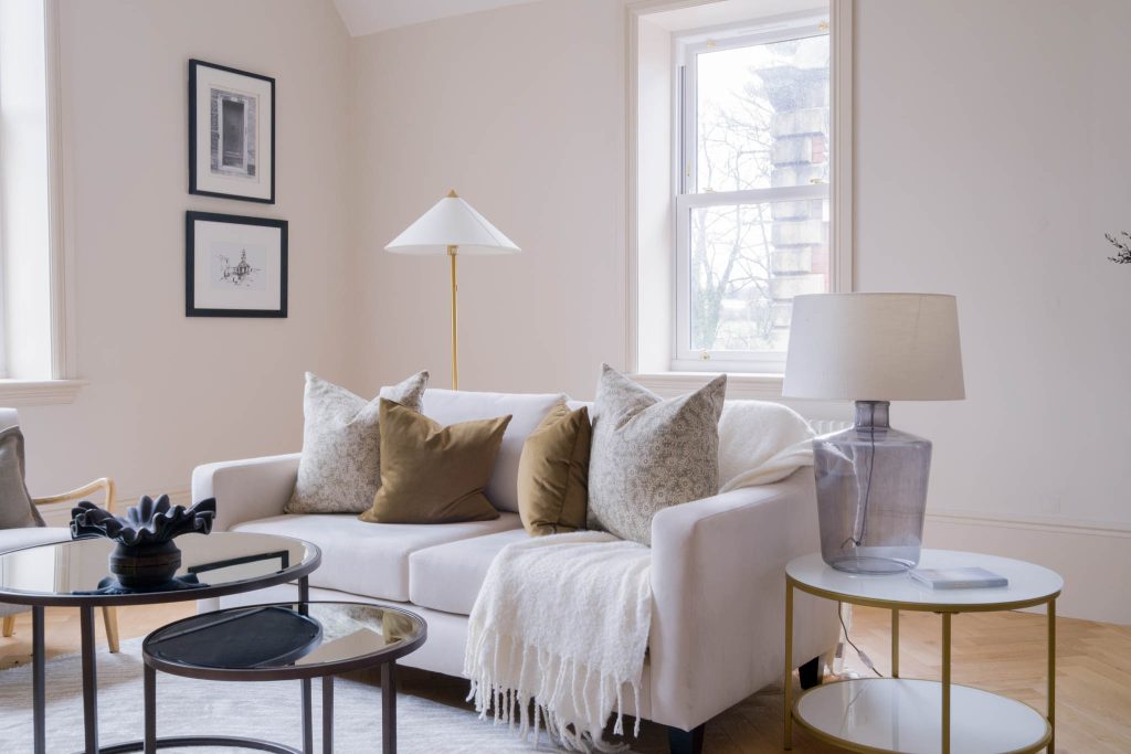 A sofa and coffee table inside of a Gloucestershire based residential property.